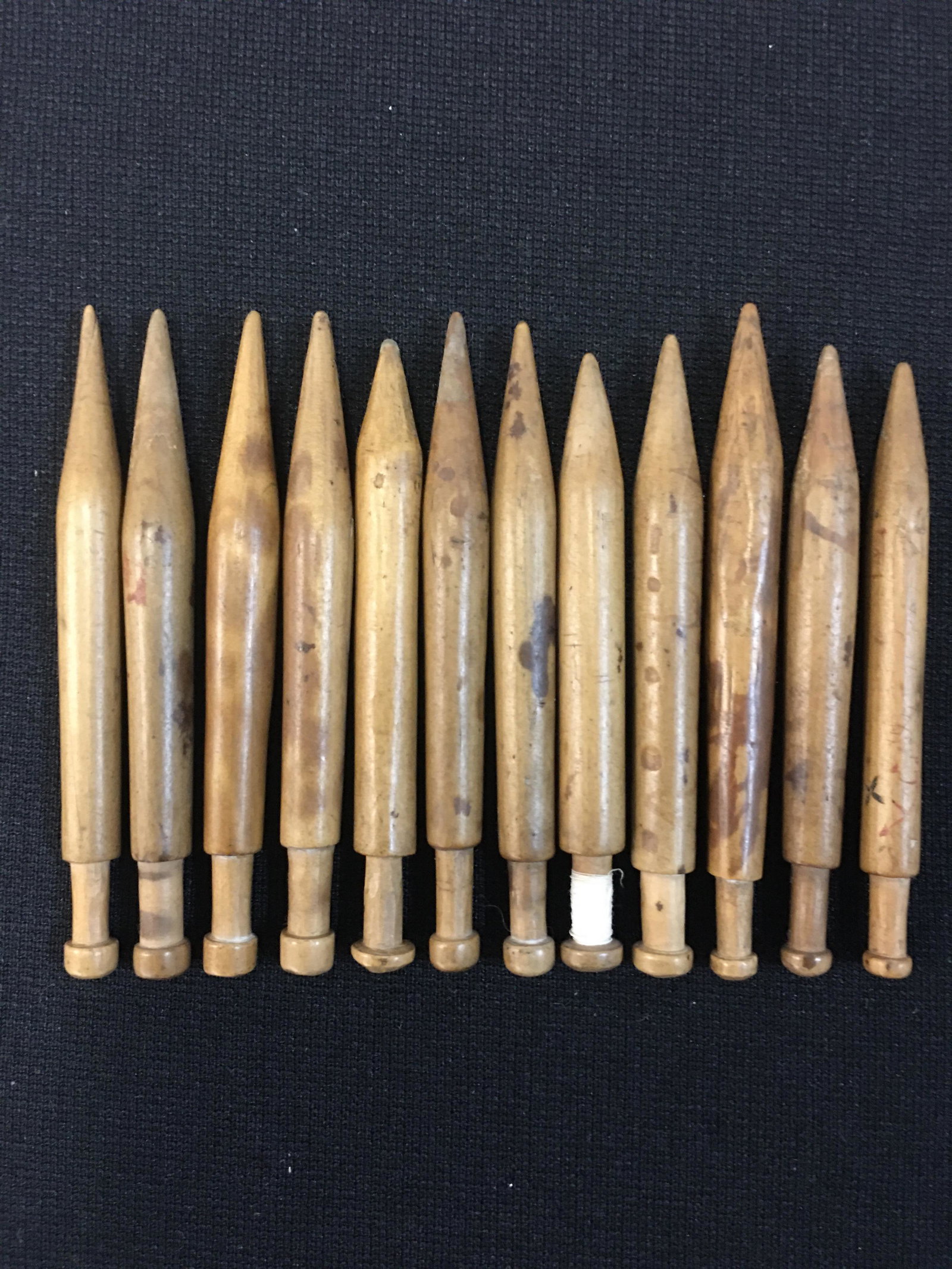(12) Downton English Wood Bobbins from Springett Collection: (12) Downton English Wood Bobbins from David Springett Collection, has card verifying it came from Springett's Antique Lace Bobbin Collection but only have 12 of the 14 listed on card. 3"