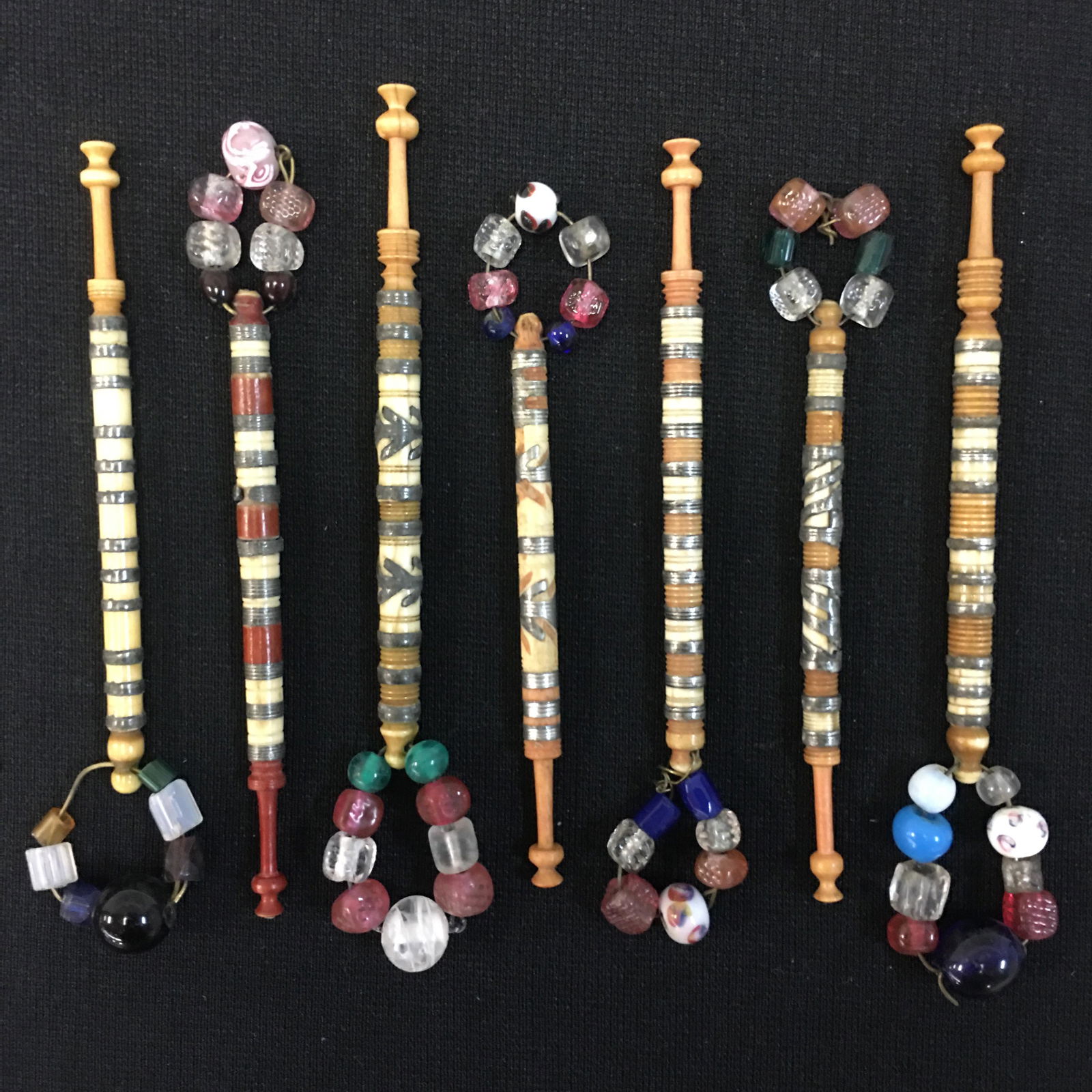 (7) Antique English Dyed Bone Pewter Inlaid Bobbins: (7) Antique English Dyed Bone Pewter Inlaid Bobbins, All Spangled, some loss to pewter inlays, 3.5"