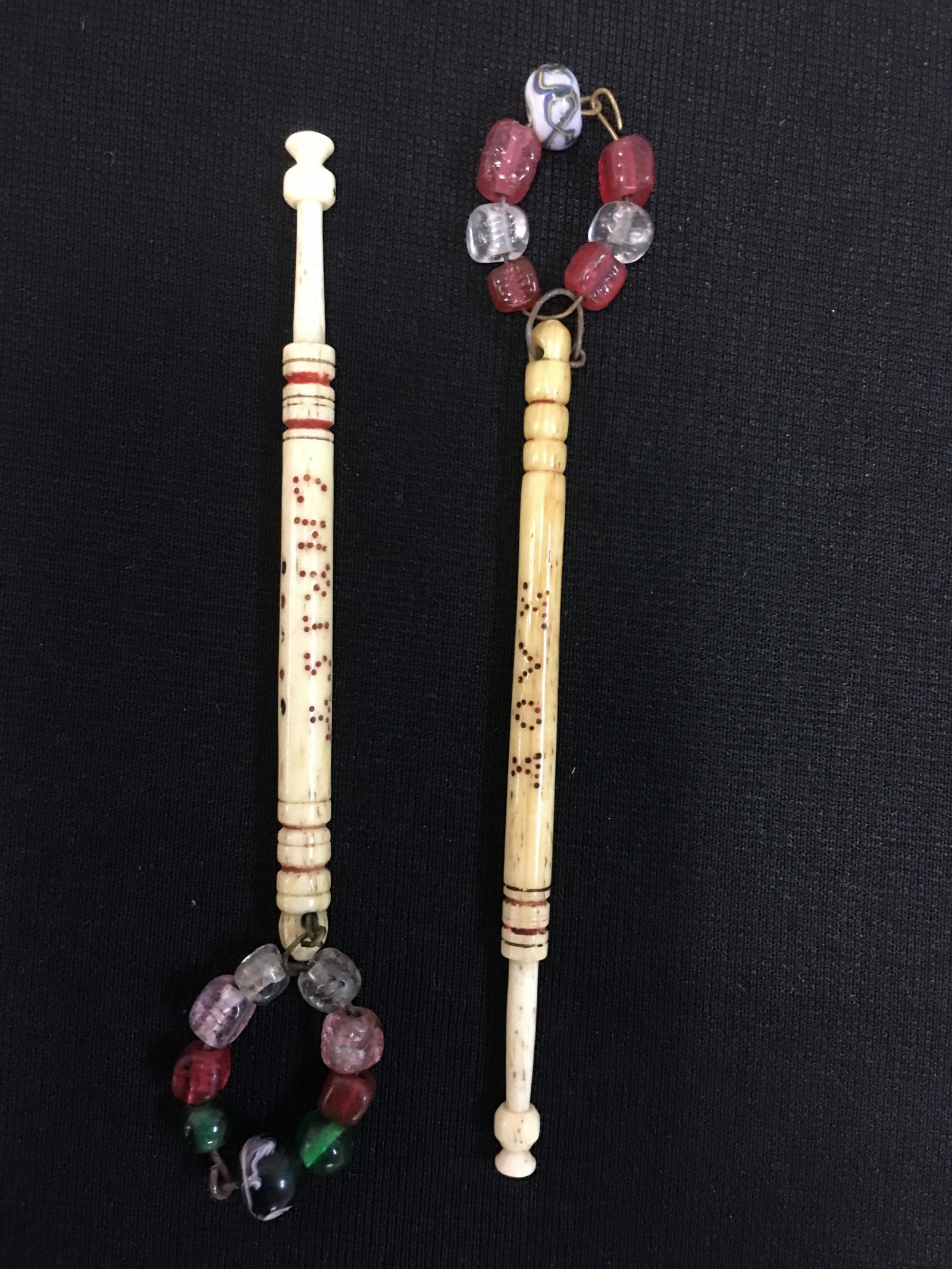 (2) Antique Bone Religious Inscribed Bobbins: (2) English Midland Antique Bone Inscribed Bobbins, both spangled, spotted colored inscriptions "Christ Crucified" and "God Is Love", 4"