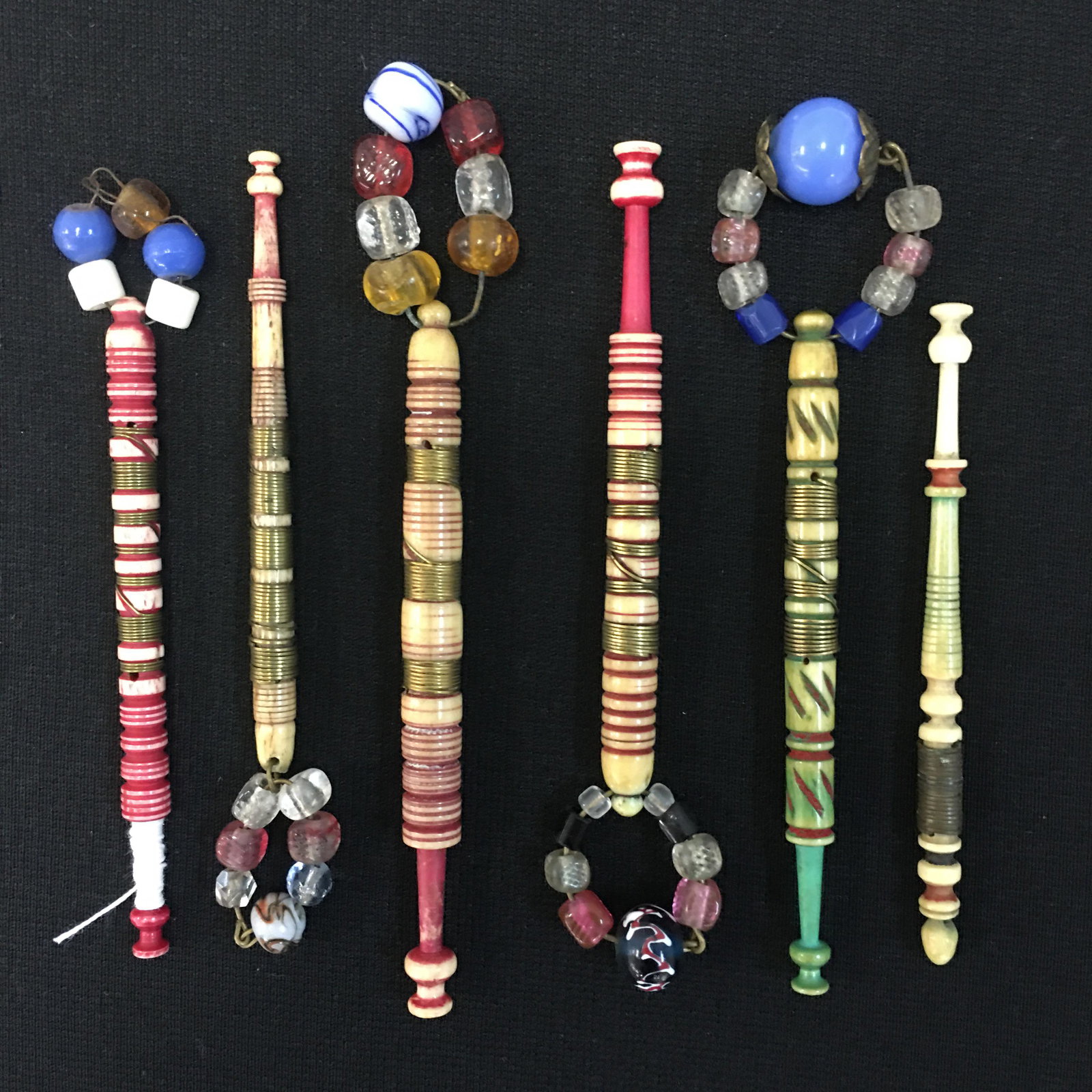 (6) Antique English Dyed Bone Wire Wrapped Bobbins: (6) Antique English Dyed Bone Wire Wrapped Bobbins,( 5)Spangled, loss on some heads and one base , 3.5"