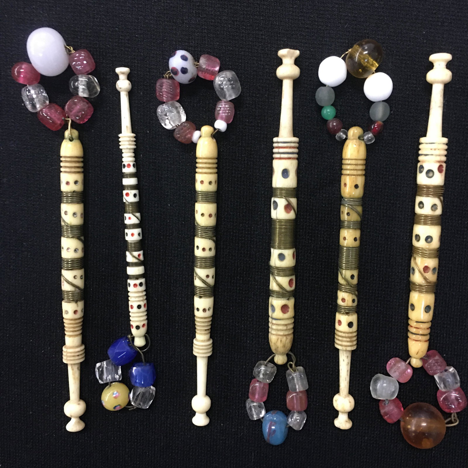 (6) Antique English Bone Wire Wrapped Lace Bobbins: (6) Antique English Bone Wire Wrapped Lace Bobbins, all spangled, with rings and spots. Three heads chipped to varying degrees. 3.5"-3.75"