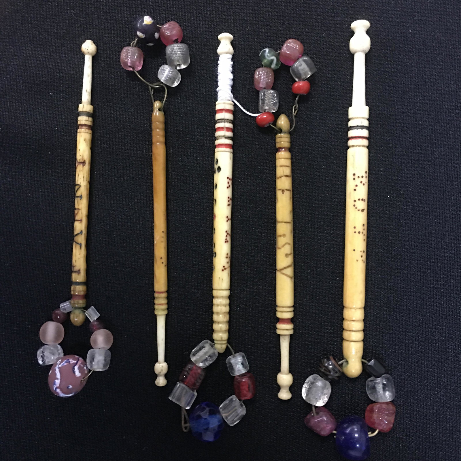 (5) Antique English Bone Name Inscribed Bobbins: (5) Antique English Bone Name Inscribed Bobbins, all spangled. Two are inscribed with lines, "Fanny" and "Betsy". "Ruth", "Eliza" and "Lucey" are dot inscribed. "Fanny" has broken head. 3.5"-4".