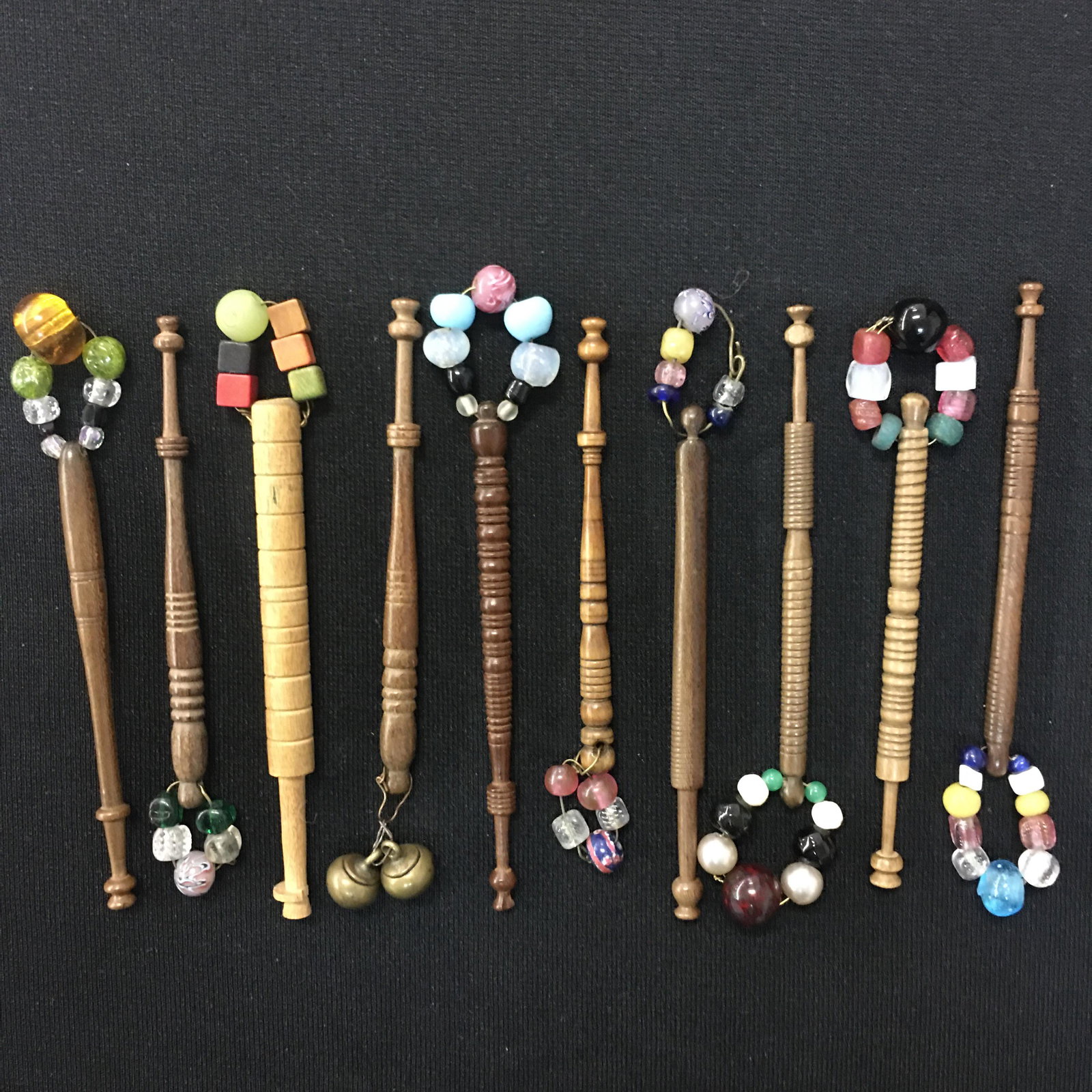 (10) Spangled Wooden Lace Making Bobbins: (10) Spangled Wooden Lace Making Bobbins. Two heads chipped. 3.75"-4".