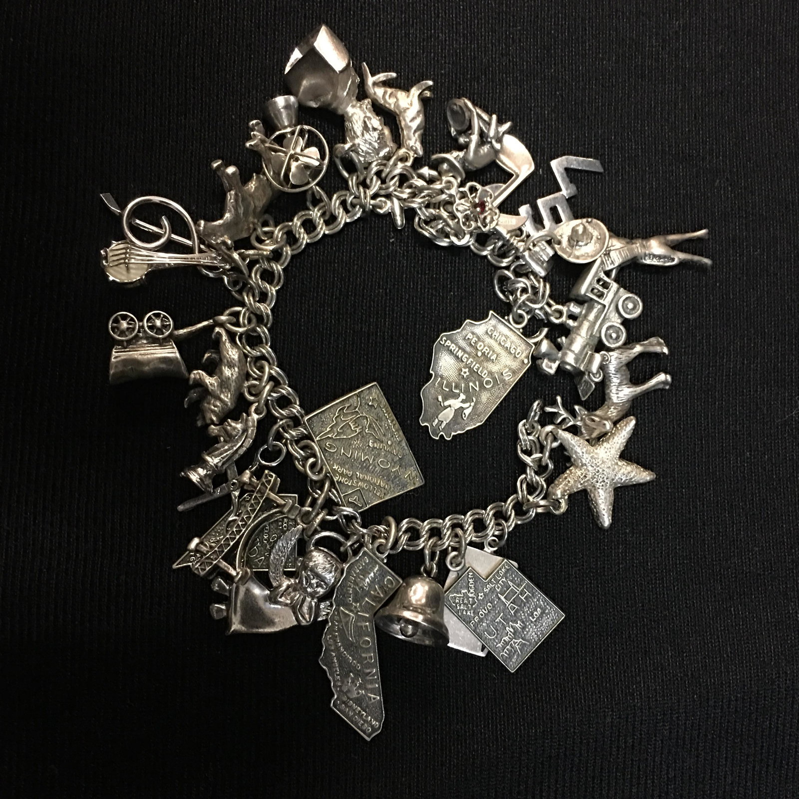 Sterling Charm Bracelet: Sterling Charm Bracelet, (29) charms; chain and most of charms marked sterling. 62g