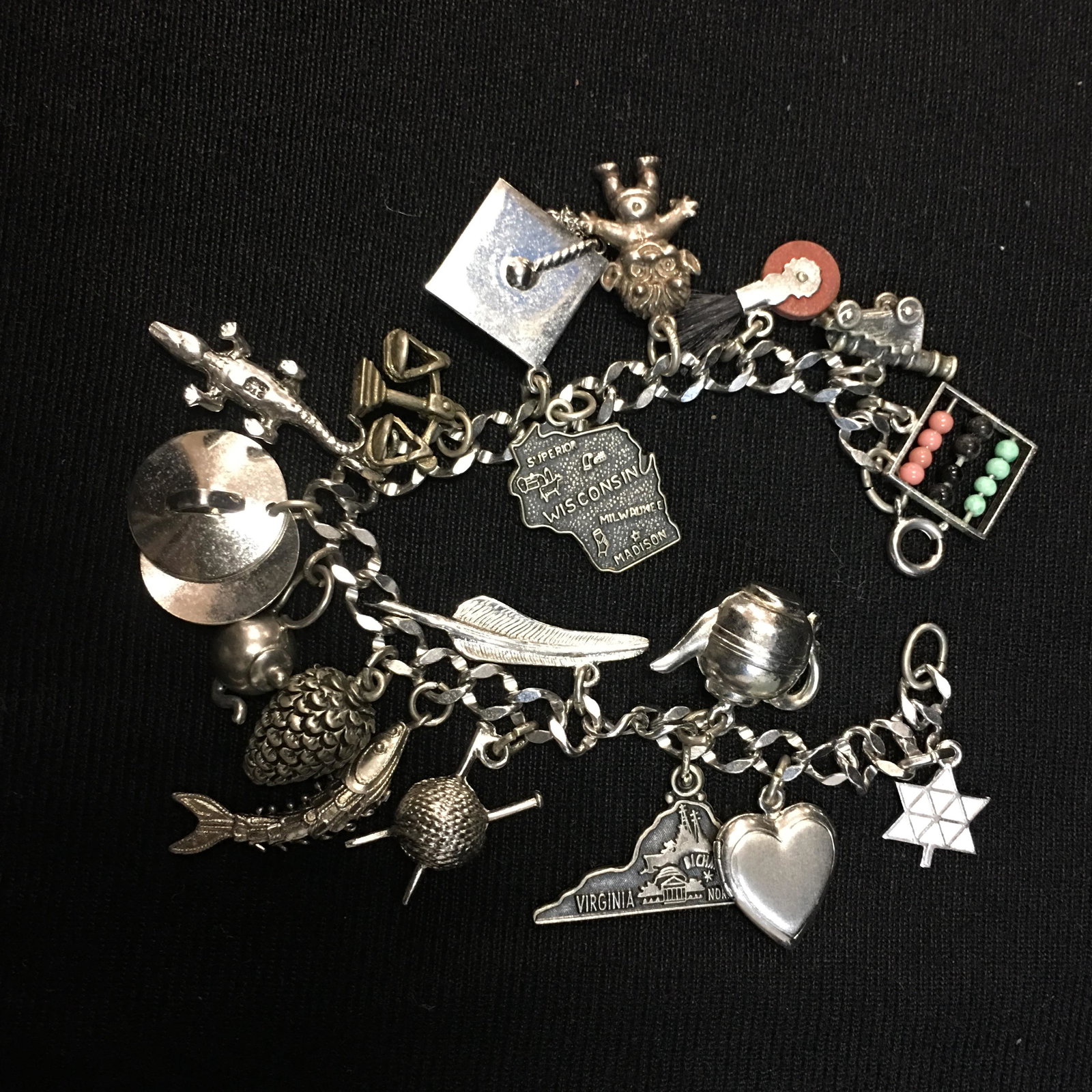 Sterling Charm Bracelet: Sterling Charm Bracelet, (18) charms; chain and most of charms marked sterling. 47g
