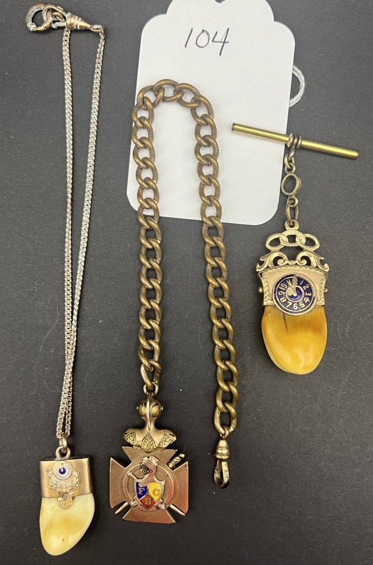 3 Lodge watch chains: 3 Lodge watch chains 1. Elks Lodge with Elk tooth mounted in GF pendant back is marked BPOE Scranton, PA. 123. 2. IOOF Maltese cross pendant, with armor