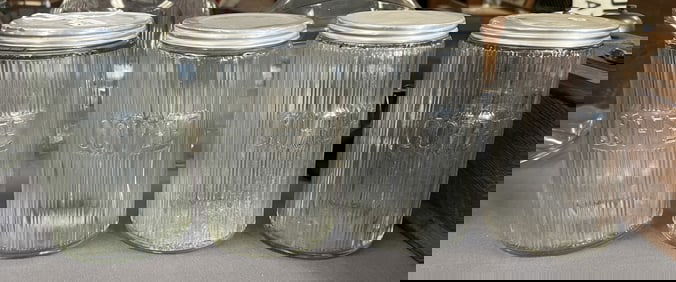 Group of Four Sellers Jars