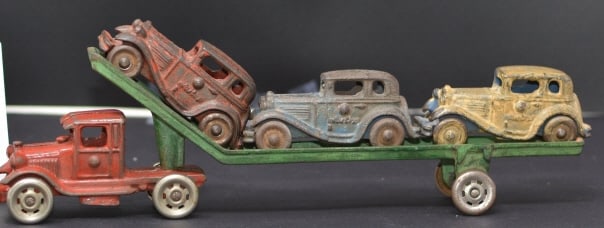 1930's Cast Iron Car Hauler red truck w/  green  trailer w/ 3 1930s sedans in red, blue  & yellow