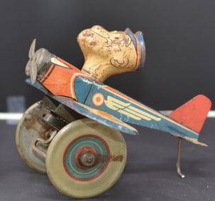Tin Wind Up Litho Popeye The Pilot airplane,   Popeye w/ pipe, in working condition 7" x 6"  x 8"