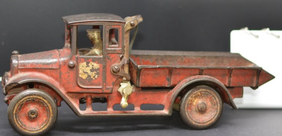 Stamped Arcade Cast Iron Dump Truck w/ lift  strap,  sticker on door is International  Harvester
