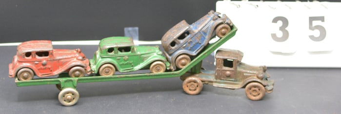 1930's Structo Cast Iron Car Hauler  blue  truck  green trailer w/ blue, red, green  sedans. 13" x