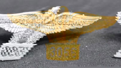 1948 Indy 500 Pit Pass Badge #3056 wheel &  wings  symbol made by Bastian Bros. Co,  Rochester, NY.