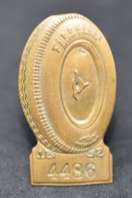 1952 Indy 500 Pit Pass Badge #4486 made by  Bastian  Bros. Co., Rochester, NY. Symbol of  Firestone