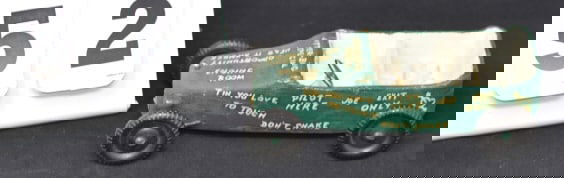 Vintage Motto Car green w/ white lettering  paper  m?ch? body, hard plastic wheels called  The