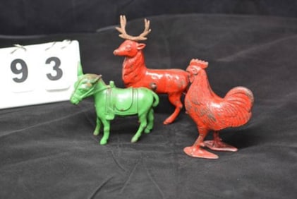 Three Cast Iron Painted Banks: Red Rooster,  Green  saddled donkey, red stag deer  4" x 7"  x 2"