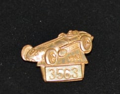 1963 Indy 500 Pit Badge #3563  made by  Bastain  Bros., Rochester, NY of car &  driver.