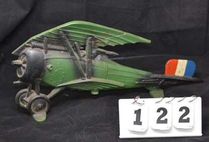 Cast Iron Door Stop Vintage Airplane retains   original paint has N142 on tail.  10" x 20"  x 2"