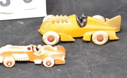 Two Cast Iron Hubley Boat Tail Racers: orange  w/  black driver white rubber tires driver  is marked