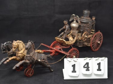 Cast Iron Horse Drawn Fire Engine 3 horse  pitch w/  driver & attendee, the pumper has a  eagle