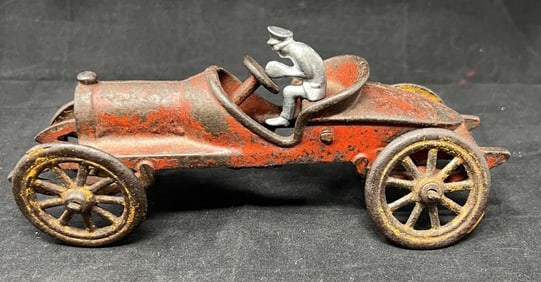 1930's Early Cast Iron Race Car  by Hubley   has some  red paint, yellow wheels, newer  driver.  3"