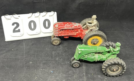 Two 1940's Die Cast  farm tractors w/  drivers:  green tractor is Minneapolis Moline  Silk Toy & red