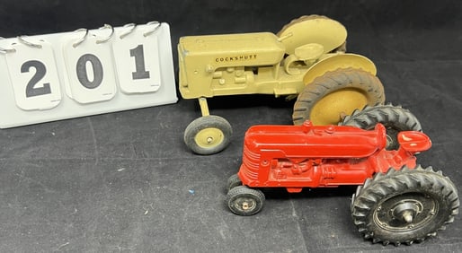 Two Vintage Toy Tractors: 1960's Cockshutt  tan  wide front end tractor missing steering  wheel,