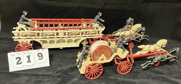 Two Cast Iron Horse Drawn Fire Apparatus: one  ladder  wagon, one is hose reel.   9" x 32"  x 9"