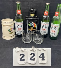 Group of Indy 500 Drinking Items includes:  1973  mug, 3 7-Up bottles, whiskey decanter,  2 1960's