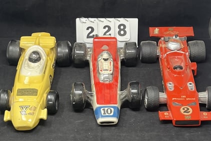 Three Race Car Decanters: Mario Andretti #9  car,  Ezra Brooks #10 car, AJ Foyt #2 car.   4" x 14" x