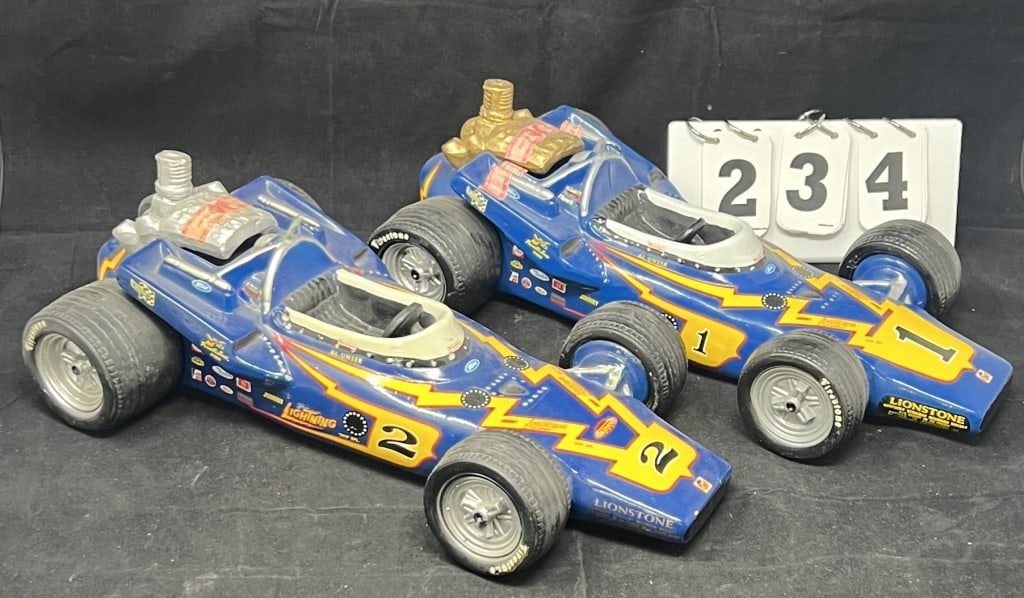 Two Johnny Lightning Decanters Race Cars: Both same car one w/ silver engine & one w/ gold: Two Johnny Lightning Decanters Race Cars: Both same car one w/ silver engine & one w/ gold engine. Al Unser cars. 3" x 15" x 7"