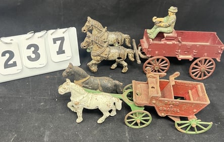 Two Cast Iron Horse Drawn Toys: Buckboard  wagon,  red box wagon w/ green driver &  sand/gravel cart
