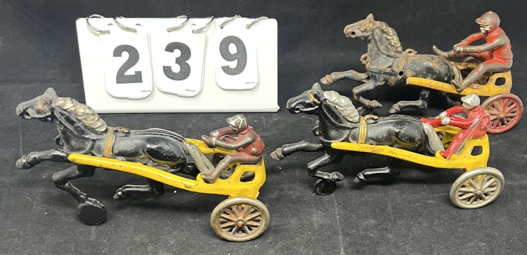 Three Kenton Toy Cast Iron Sulkies w/ Drivers one driver is mismatched on broken sulky. 4" x 8": Three Kenton Toy Cast Iron Sulkies w/ Drivers one driver is mismatched on broken sulky. 4" x 8" x 3"