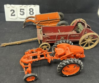 3 Vintage Farm Toys: Cast iron pull type slip scoup orange 3" x 8" x4" ; John Deere on steel