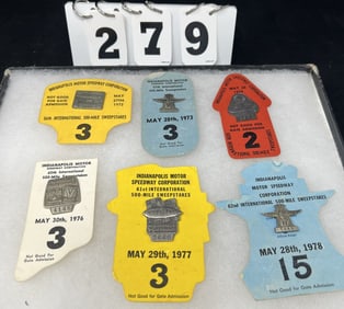 Group of  6  Indy 500 Pit Pass Badges w/  Backers:   1972 #2540 on yellow backer, 1973  #2936 on