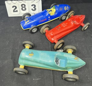 Three Plastic Wind Up Racers including  Pagliuso  Eng Co. marked Glendale, CA blue &  yellow car,