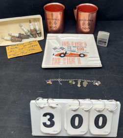 Indy 500 Memorabilia includes 1960 metal  mugs,  Zippo lighter, 1964 ashtray, bracelet  w/ 6