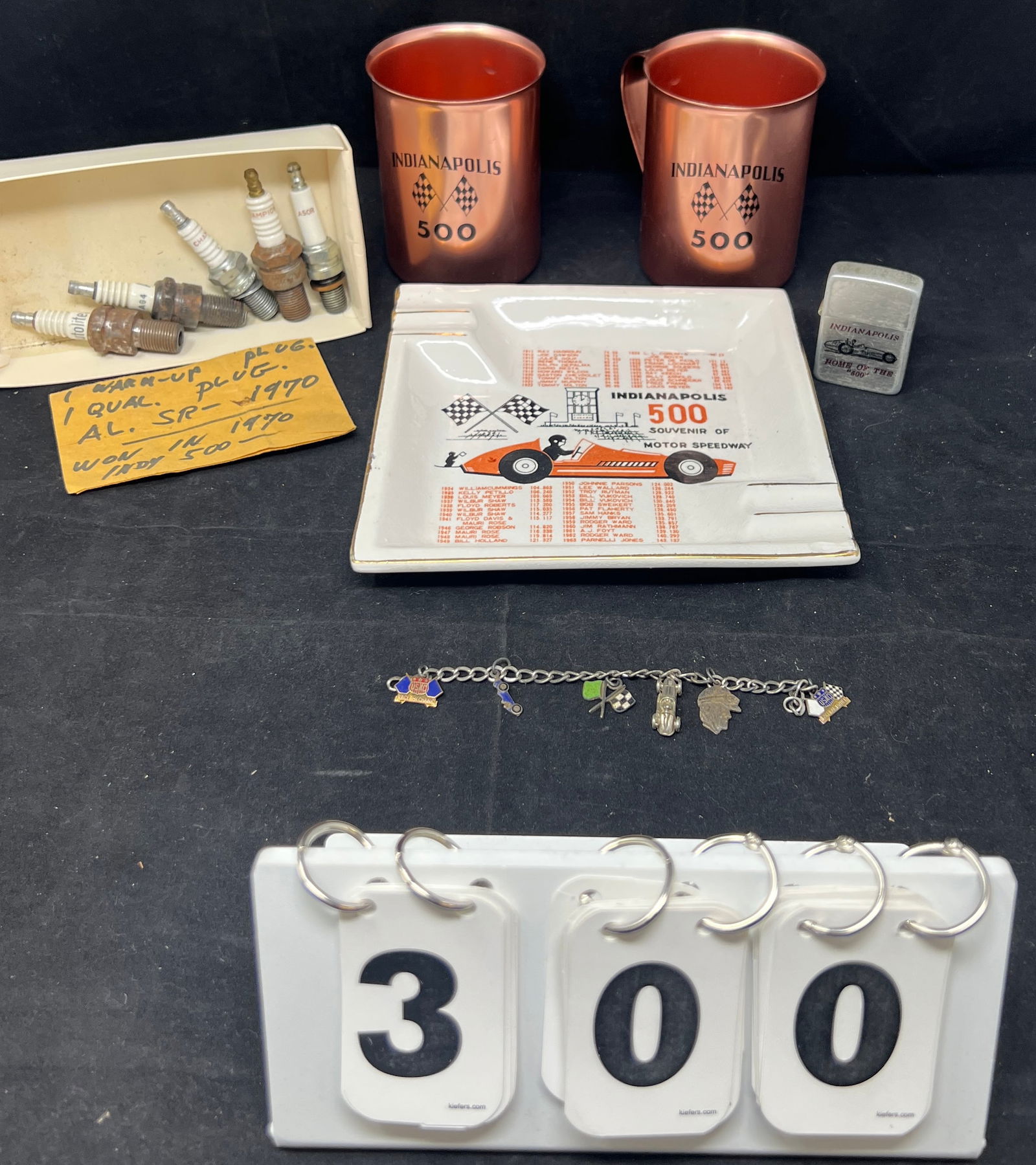 Indy 500 Memorabilia includes 1960 metal  mugs,  Zippo lighter, 1964 ashtray, bracelet  w/ 6 (1 of 7)