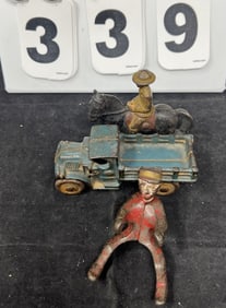Three Cast Iron Toys: AC Williams 1930's  stake bed  truck, WWI Soldier mounted on  black horse, &