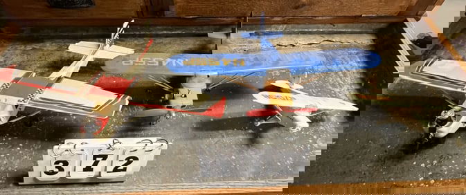 Two Cox Airplanes & One Model Airplane; 2 Cox  are  complete w/engines.  Largest is 4" x  12" x 16"
