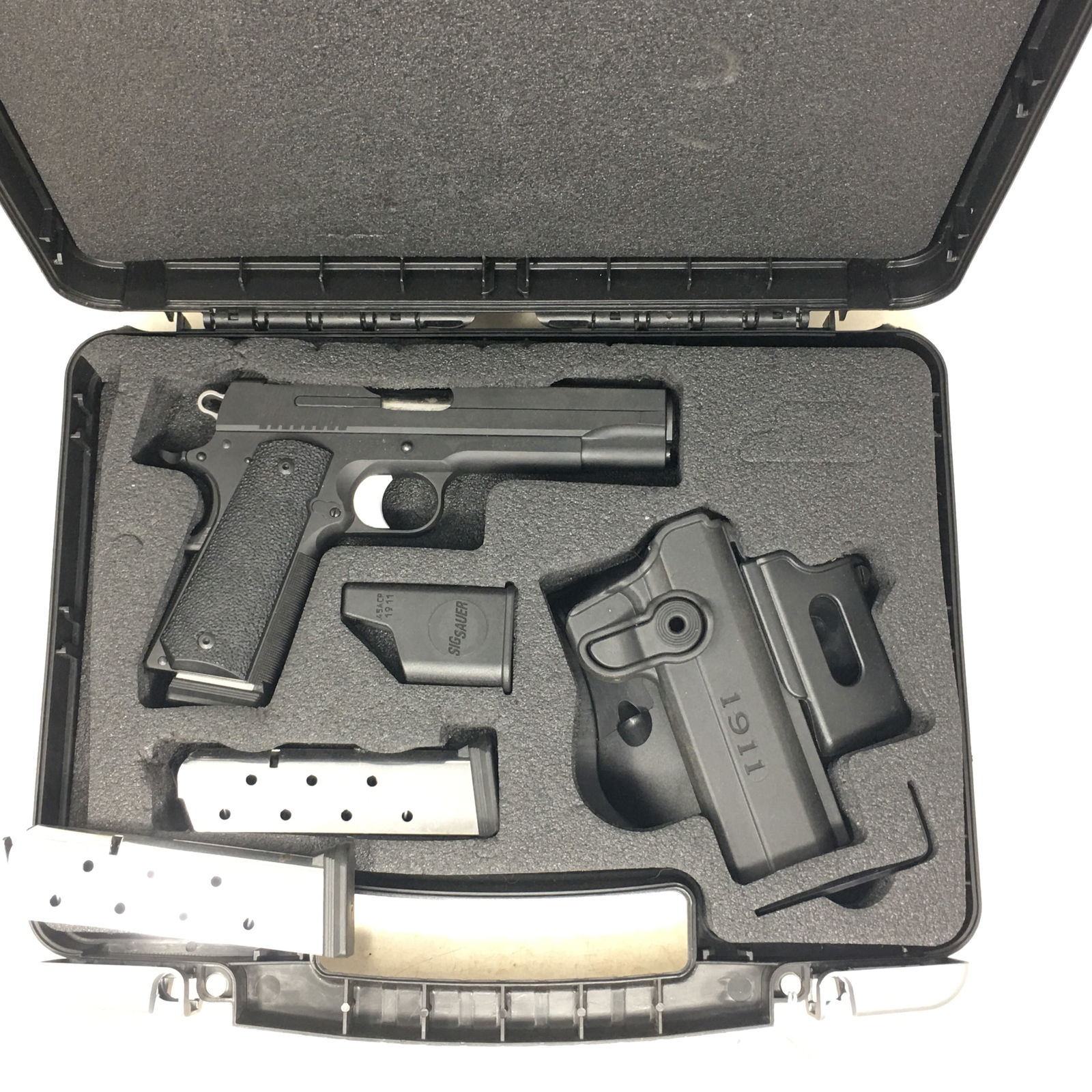 Sig Sauer 1911 TacPac, 45ACP, Semi-Auto Pistol: The Sig Sauer 1911 TacPac is a single-action, semi-auto handgun chambered in 45 ACP with 5" barrel. This pistol combines the legendary design of the 1911 with modern refinements today’s gun enthusia