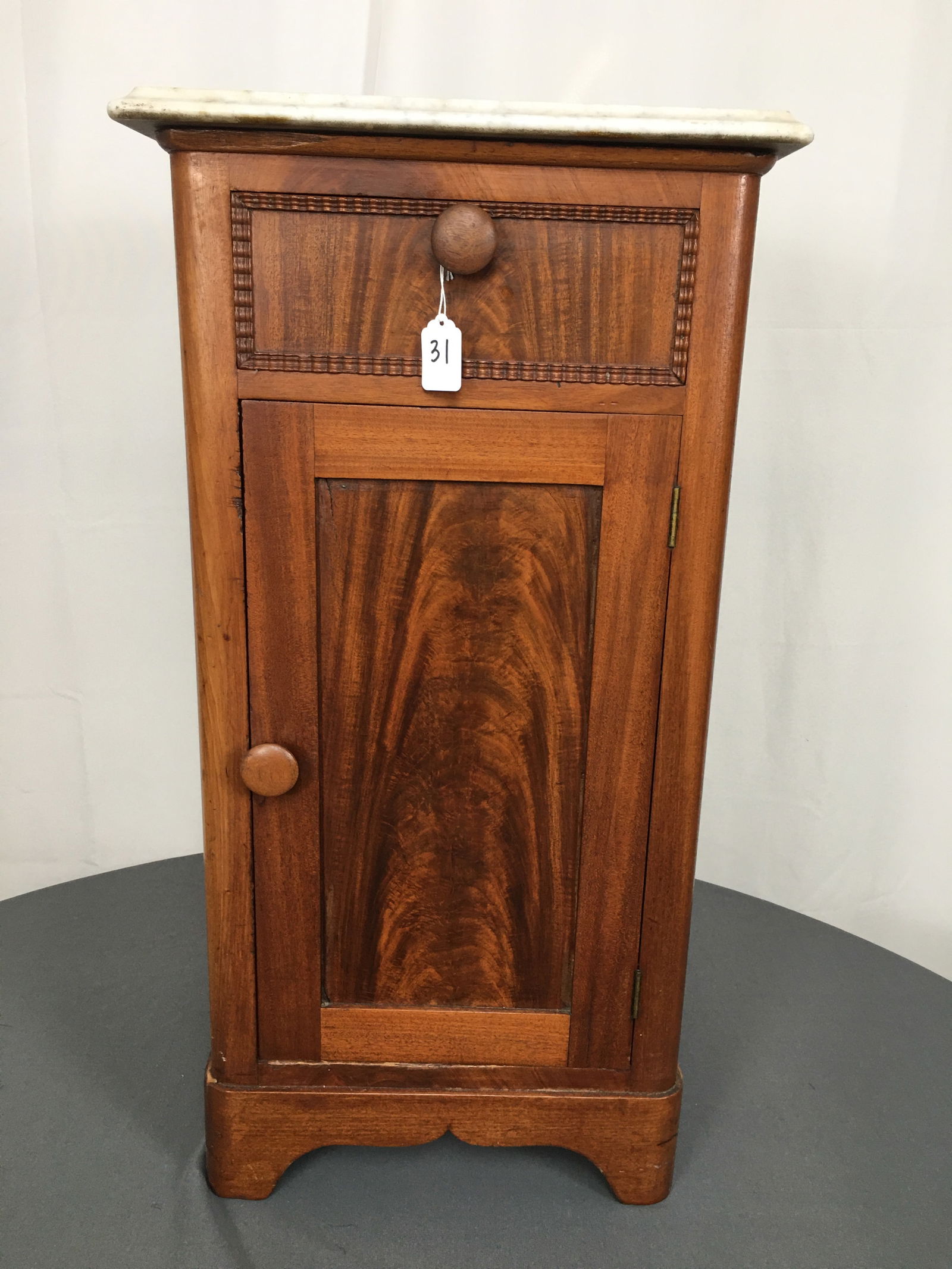Marble Top Stand: Marble Top Stand. One drawer over one door. Marble top chipped at back left corner. 15.5"W x 14"D x 30"H
