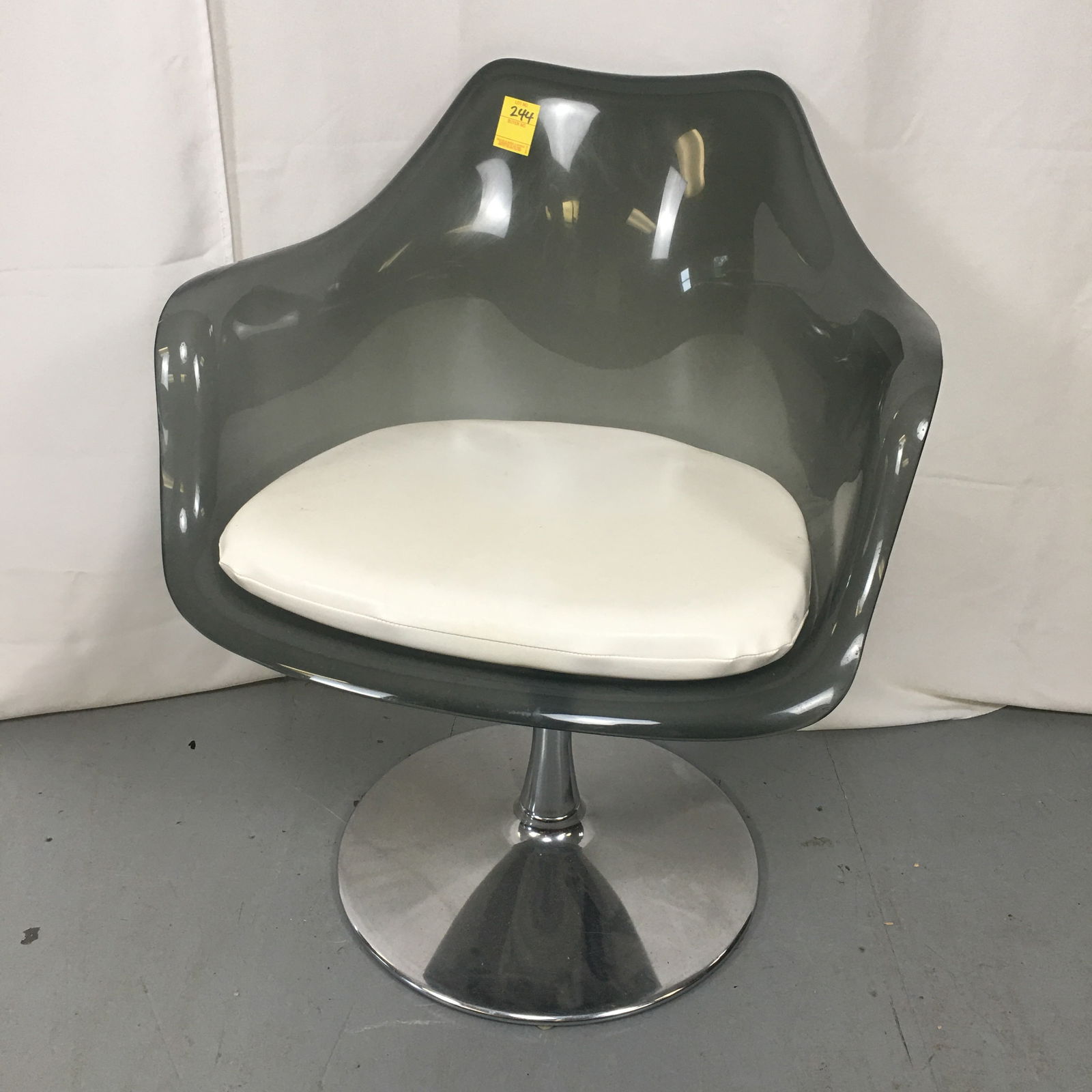 MCM Smoked Lucite Tulip Chair: Midcentury Modern Smoked Lucite Molded Swivel Tulip Chair On Chrome Pedestal Base. With white vinyl seat cushion. Also with extra chair base. 24.5"W x 23.5"D x 31"H