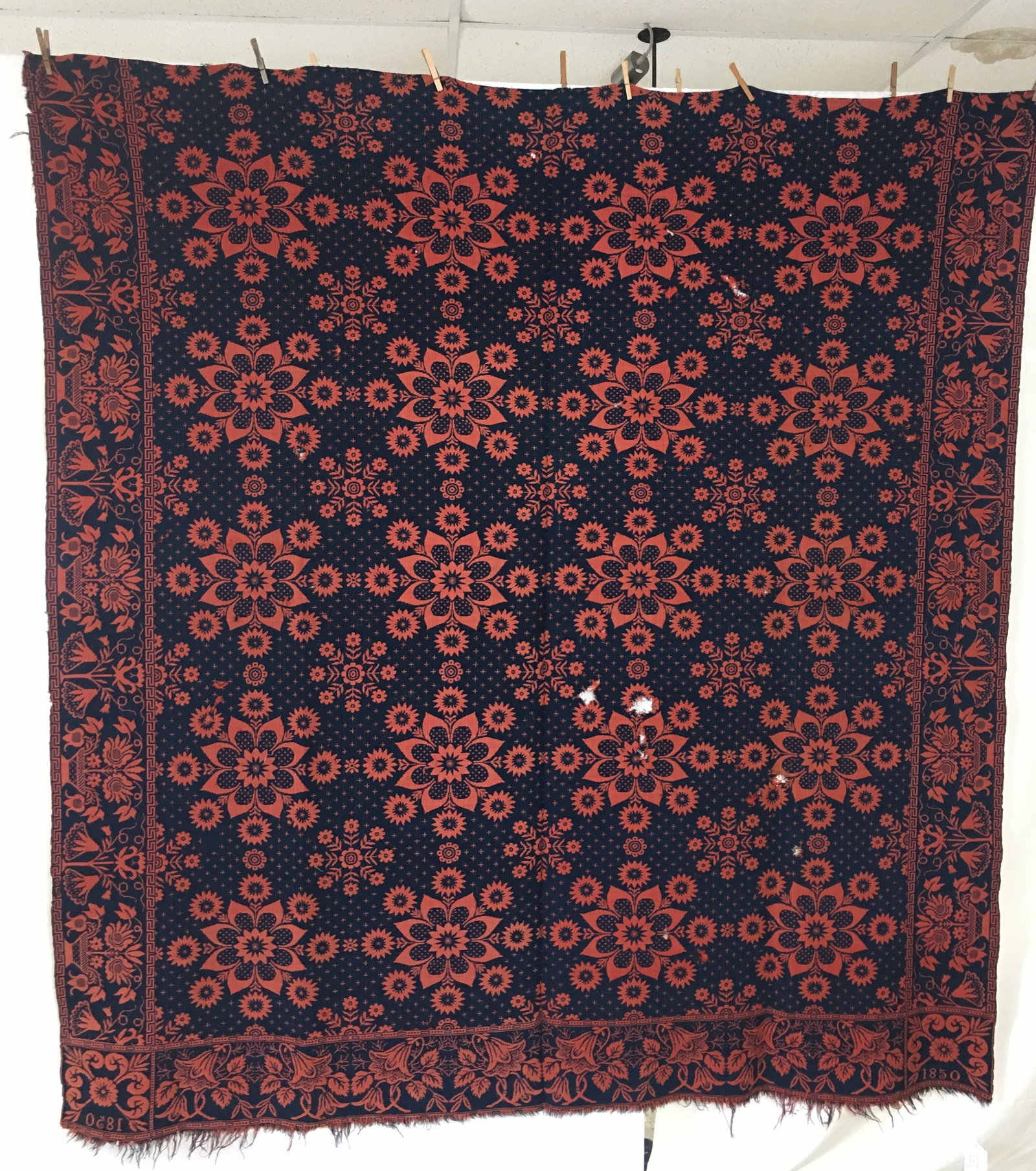 1850 John Rogers Indiana Coverlet: 1850 John Rogers, Wayne County Indiana, weaver. Red & blue coverlet with flower basket and Greek key border & floral medallion pattern center. 1850 date blocks. Some holes. 78"W x 82"L