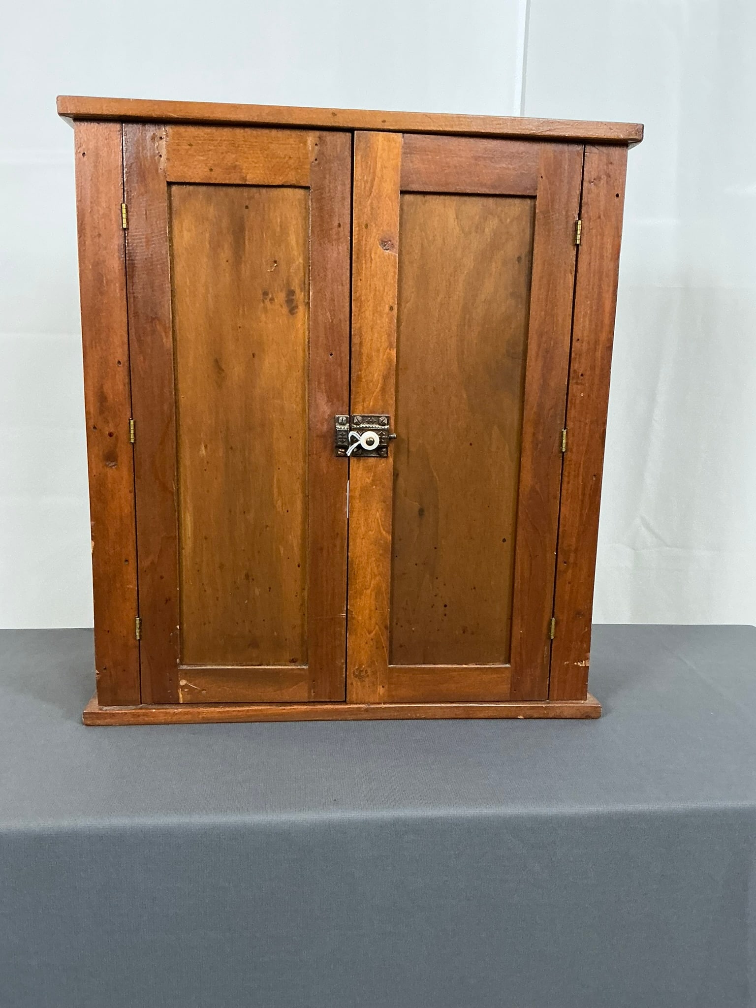 Blind Front Double Door Wall Cabinet: Blind front double door wall cabinet. Picture frame top with 3 shelf interior. 19"W x 7"D x 21"T
