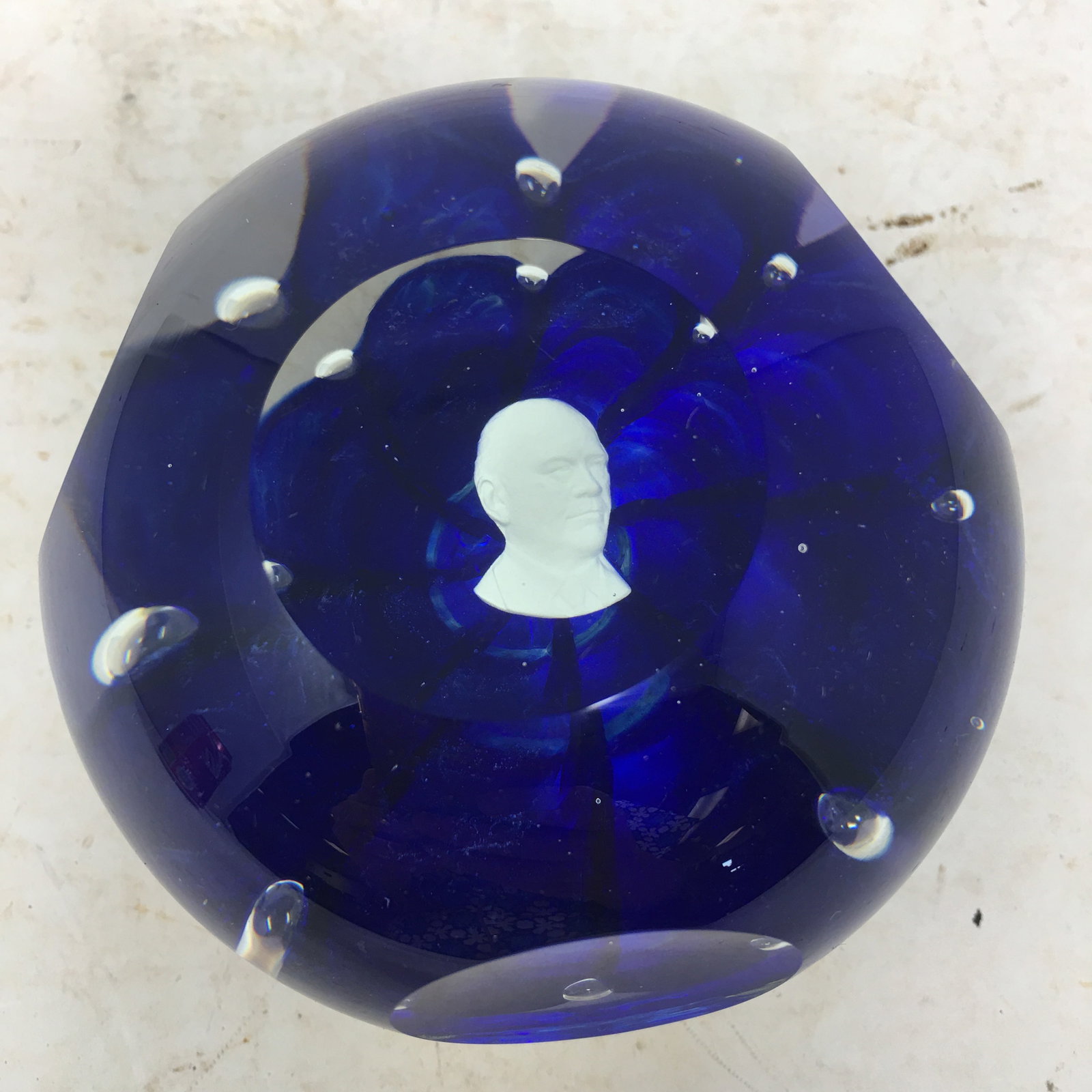 Joe St. Clair Sulfide Bust Paperweight: Joe St. Clair Sulfide Bust Paperweight. Royal blue with white sulfide bust. 4"W x 2.5"H