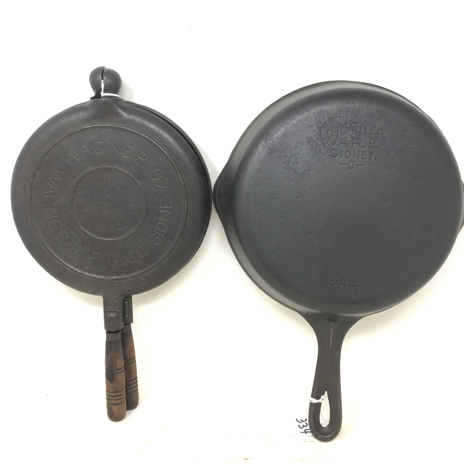 Wagner Ware Skillet & Waffle Maker: 1) #6 Wagner Ware Cast Iron Skillet, 14"L x 9.5"W. 2) #8 Wagner 2-piece Waffle Maker marked Pat'd July 26, 1882. 14"L x 7.5"W