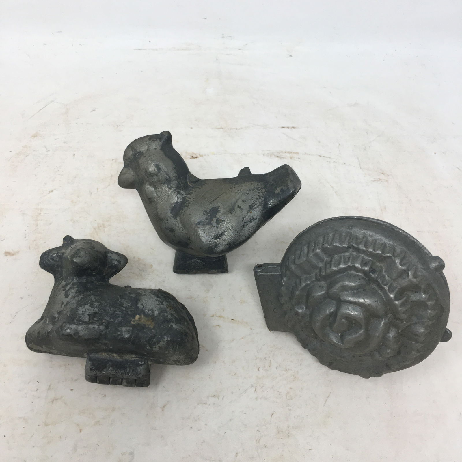 (3) Pewter Ice Cream Molds: (3) Pewter Ice Cream Molds: Flower No. 554, 3.5" x 3.5"; Chicken 3.5" x 3"; Lamb 3.5" x 2.5"