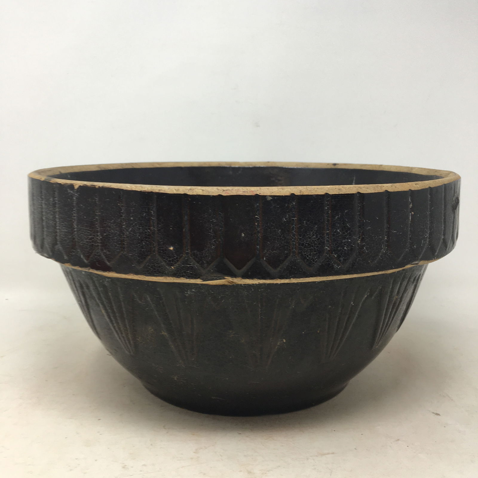 Large Brown Stoneware Bowl: Large Brown Stoneware Bowl stamped USA on bottom. No cracks or chips. 12.5"W x .5"H