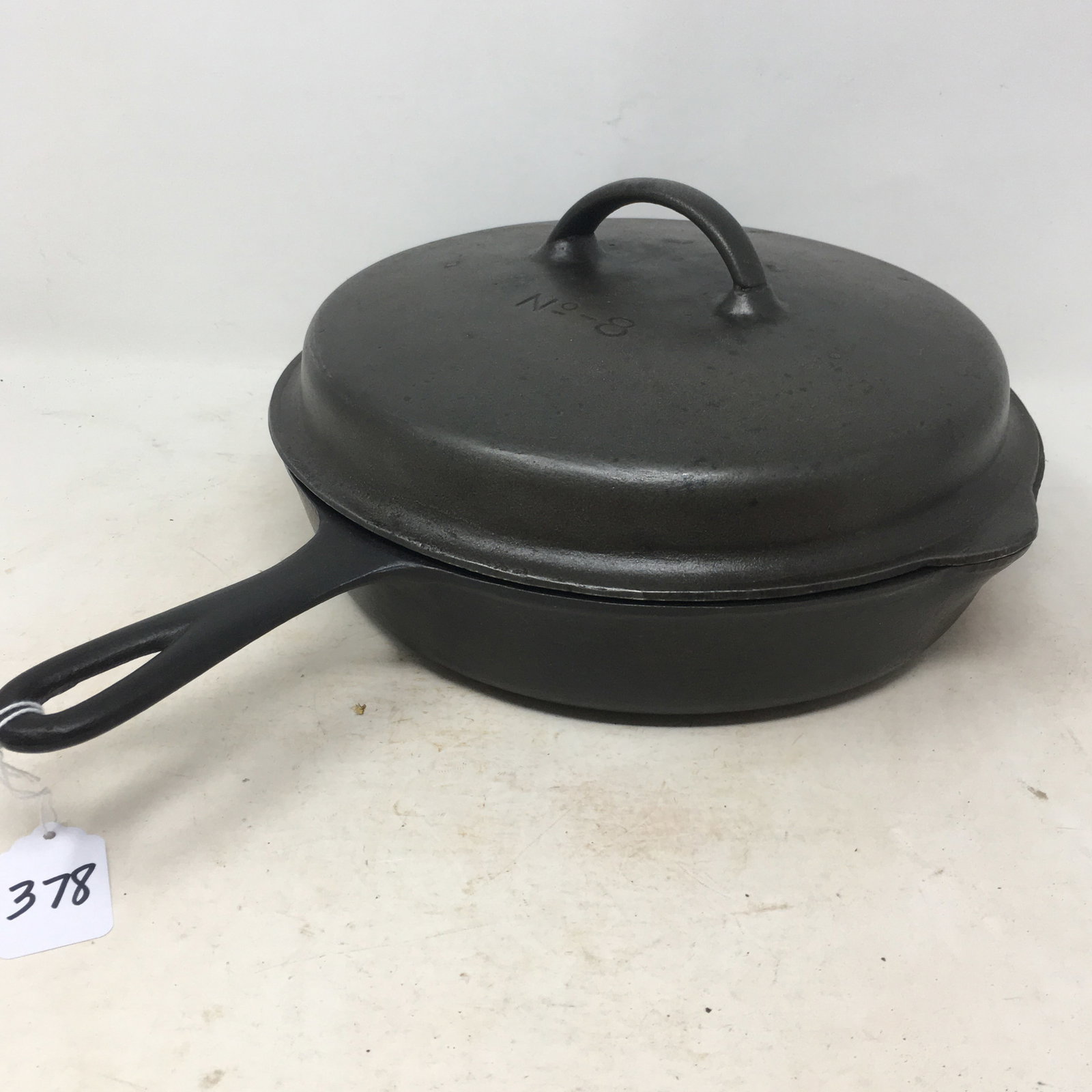 #8 Cast Iron Skillet and Lid: No. 8 Cast Iron Skillet & Lid. Bottom marked 8C. Lid marked No. 8. 15.25"L x 11.25"W x 5.5"H