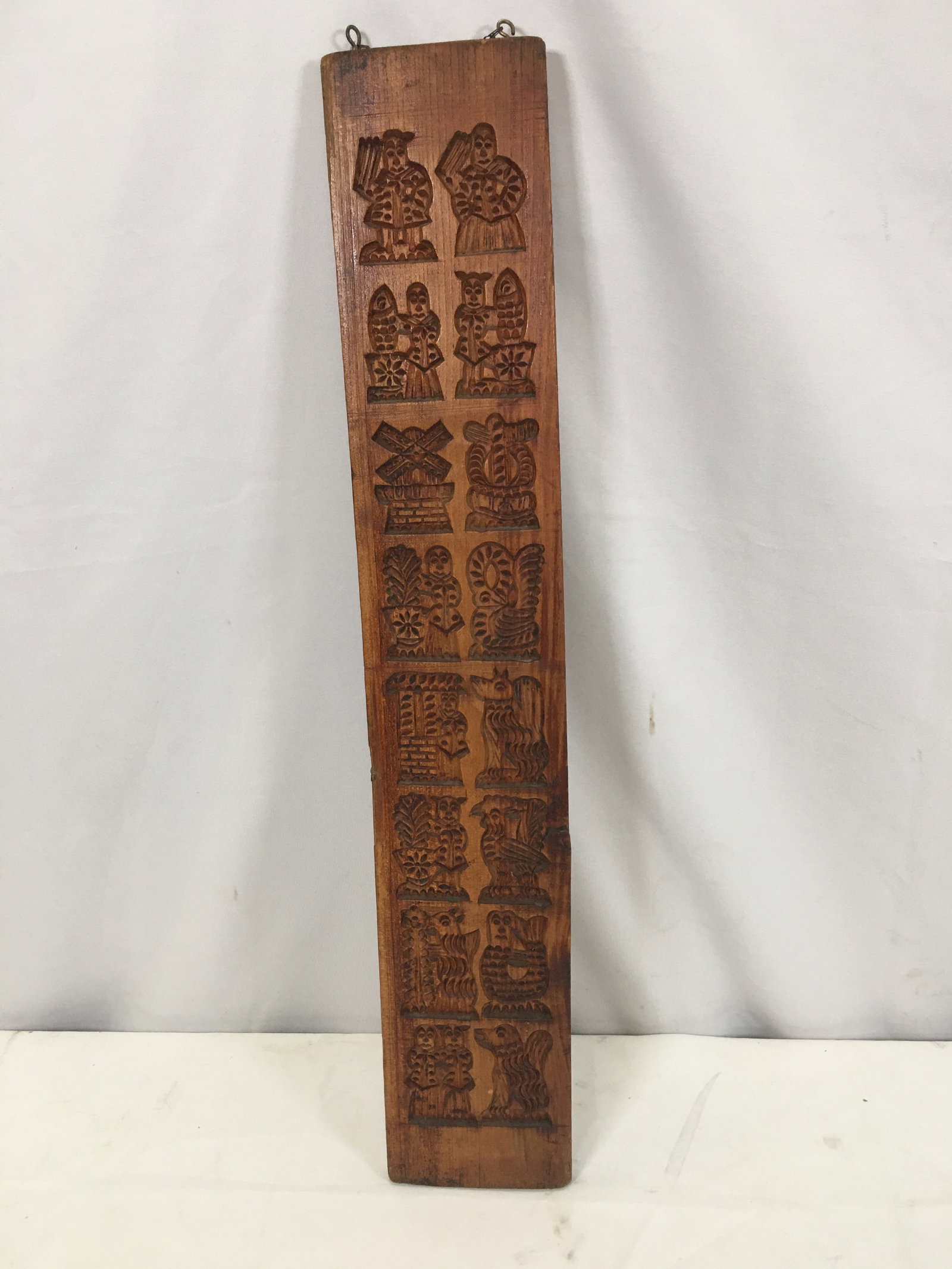 Figural Gingerbread Mold: Figural Gingerbread Mold. Depicts dogs, roosters, men, women, and windmill among others. 27"L x 4.75"W x .75"D
